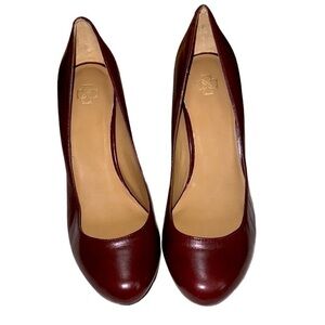 Ann Taylor leather pumps, size 7 1/2 burgundy with metal logo on leather bottom